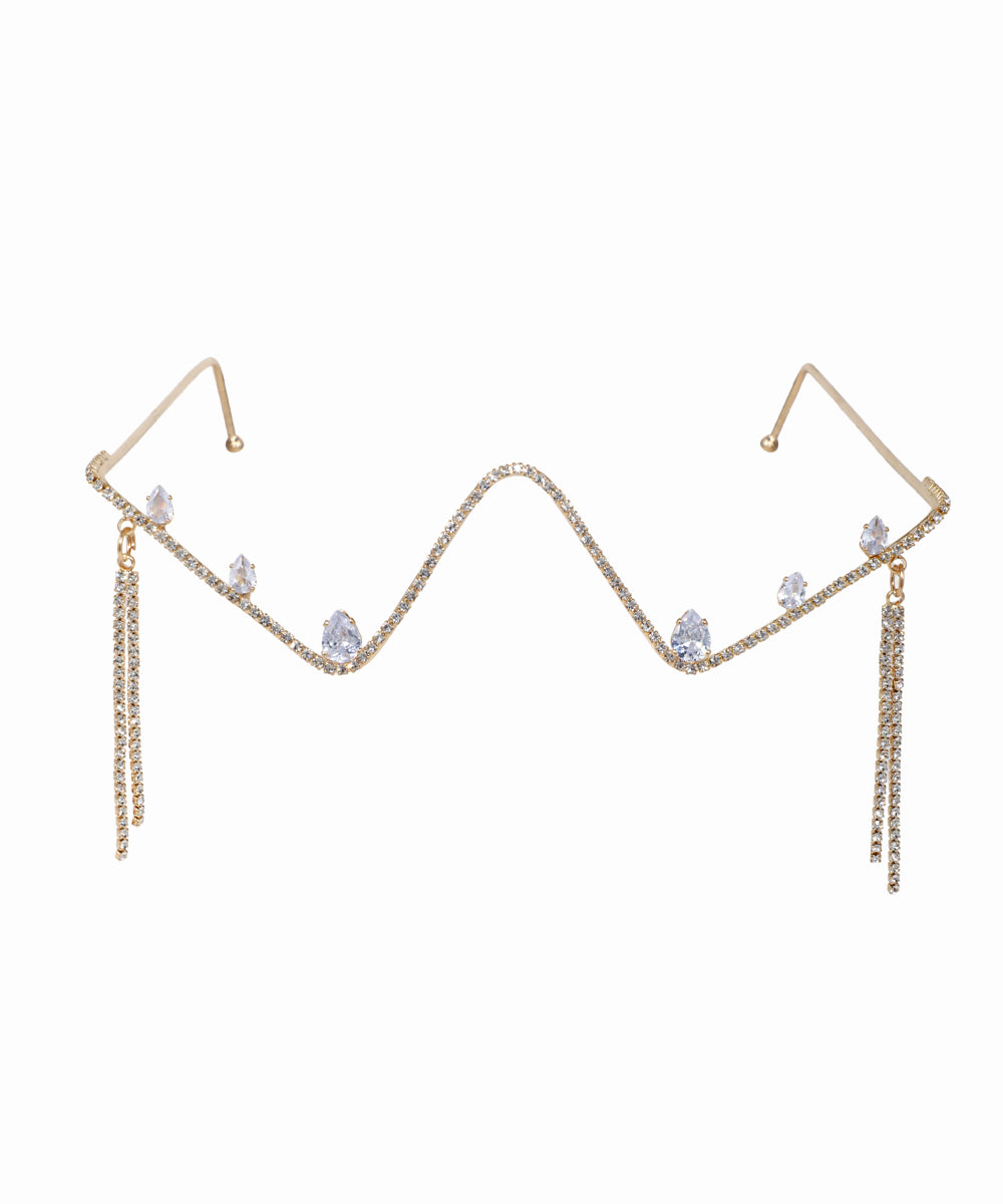 Gold-tone facelet with wavy crystal-studded bar, pear drops, and crystal draped tassels.