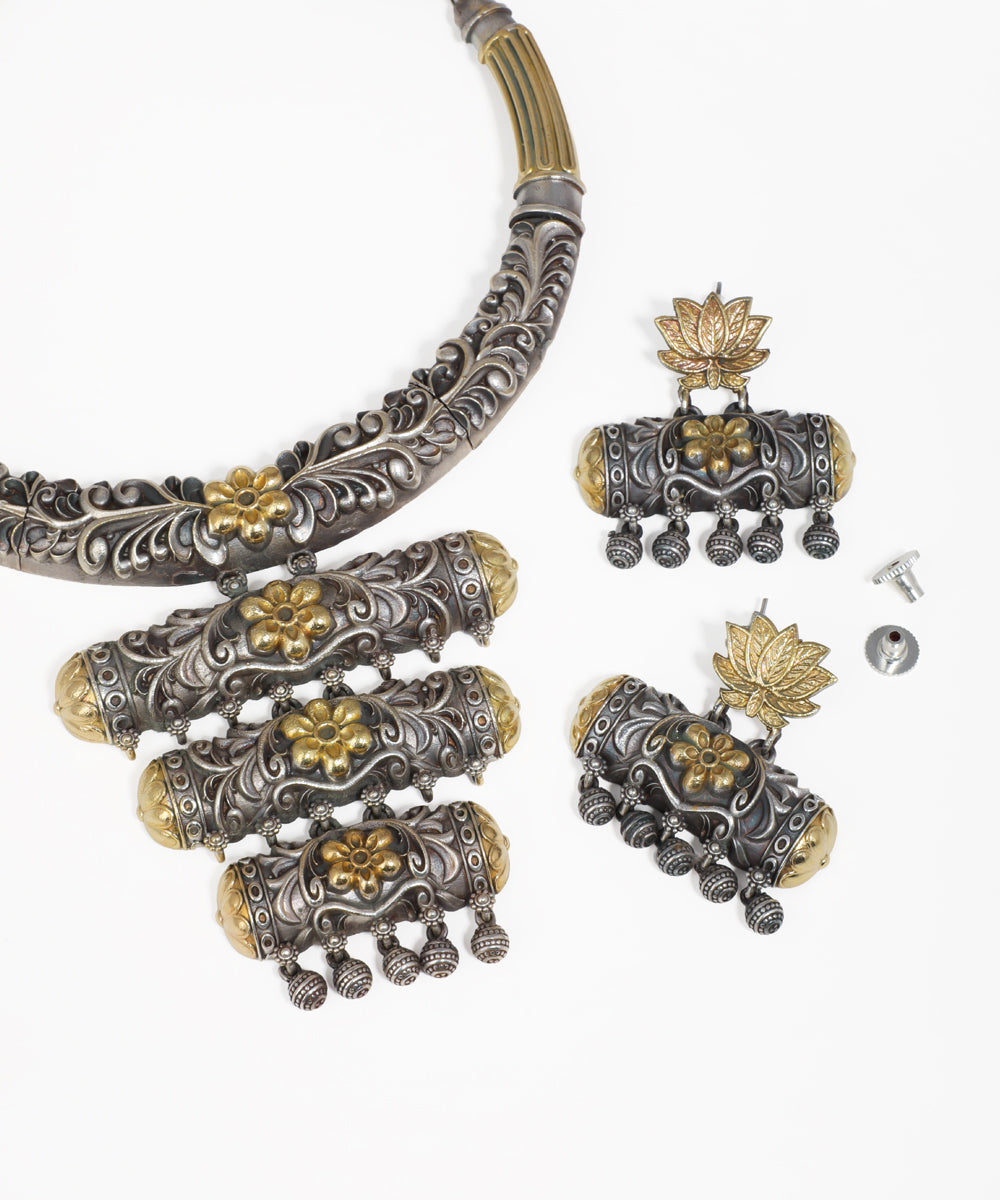 Intricate oxidised necklace set with floral detailing, statement pendant and matching earrings