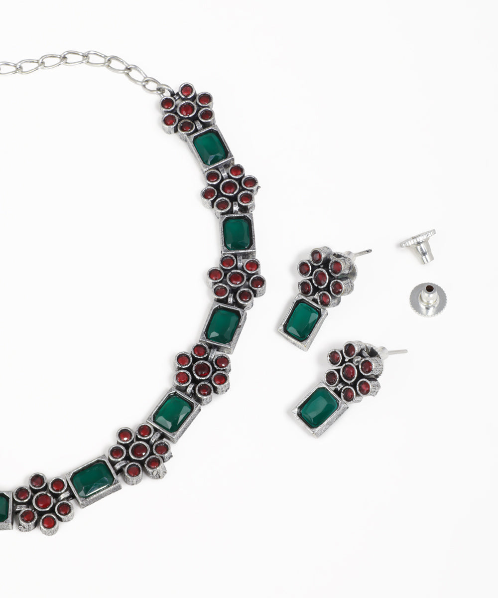Vintage-inspired floral oxidised necklace and earrings set with gemstone accents