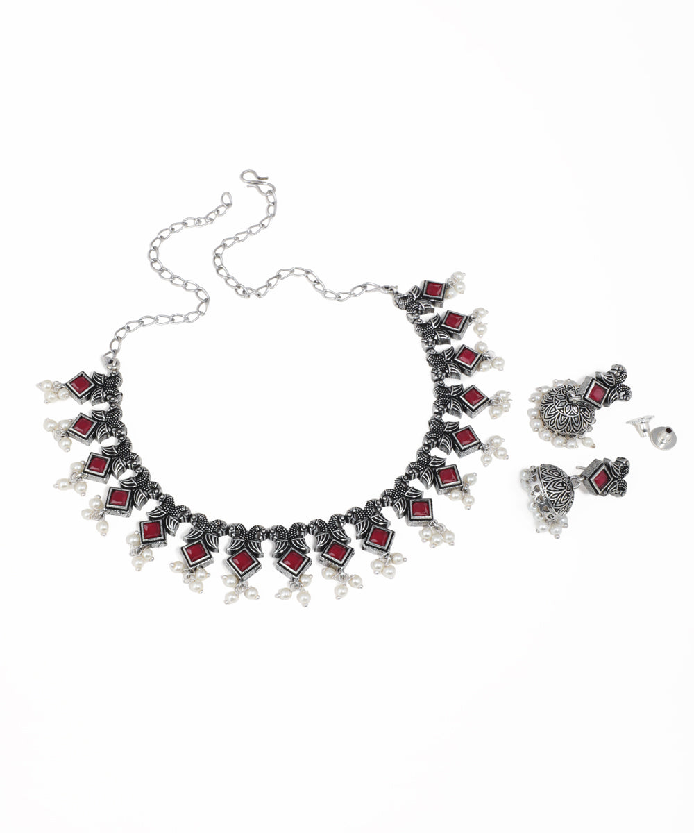 Traditional oxidised jewelry set featuring multicolor stones, floral details and pearl drops