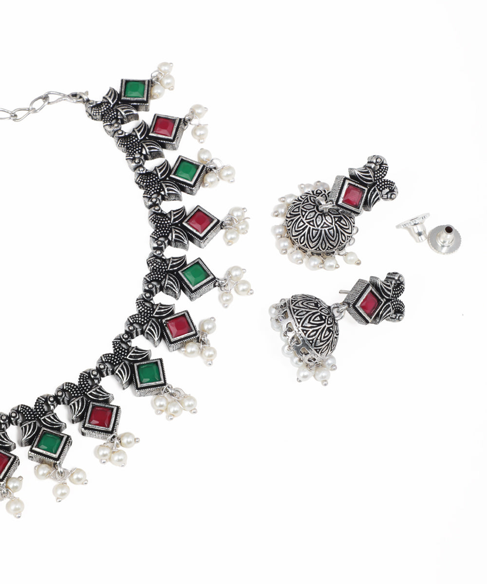 Handcrafted oxidised necklace set with vibrant gemstone details and matching drop earrings