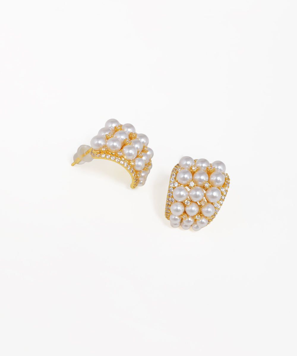 Crescent pearl cluster stud earrings with gold-tone finish and crystal accents