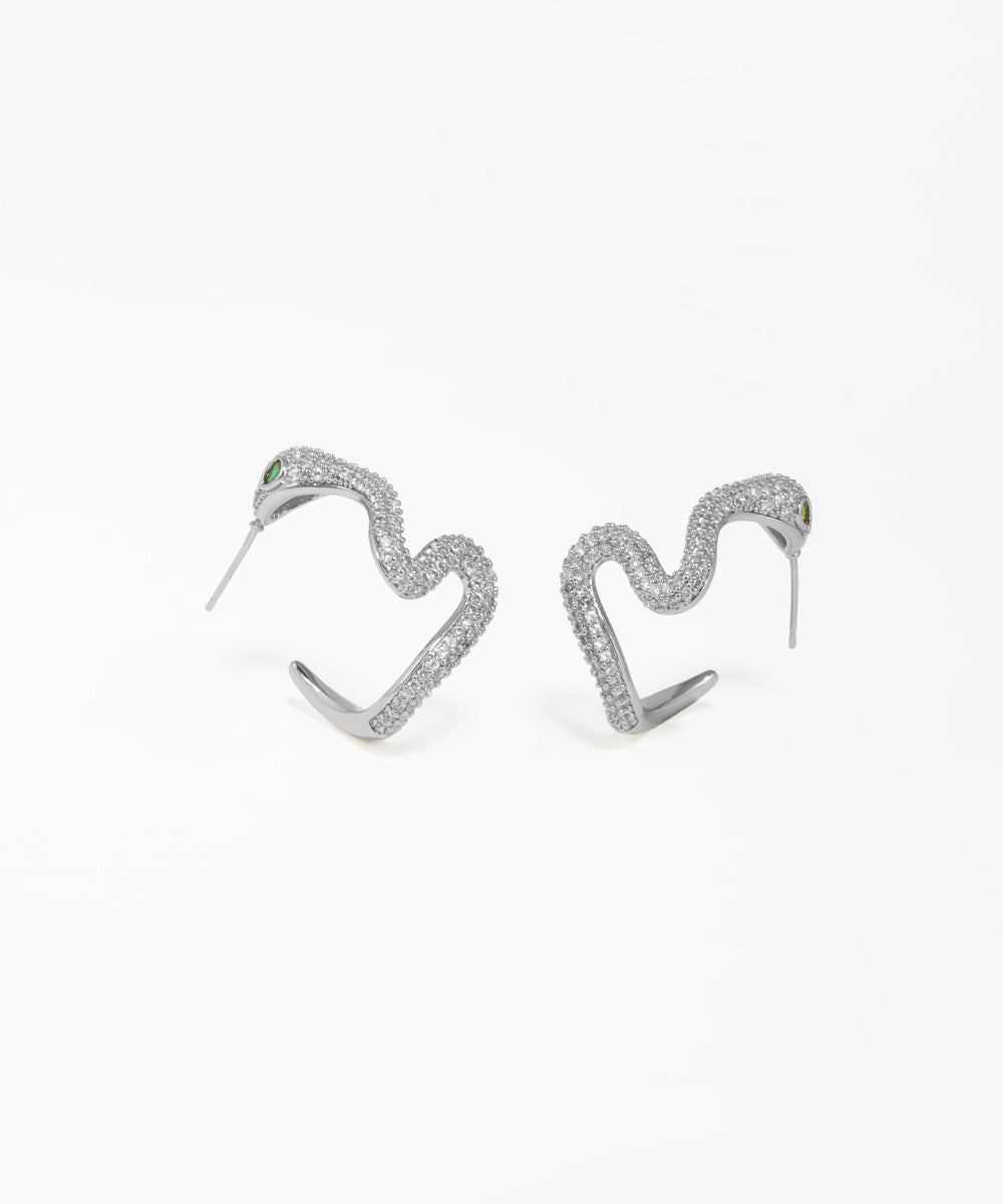 Statement snake stud earrings with shimmering crystal embellishments