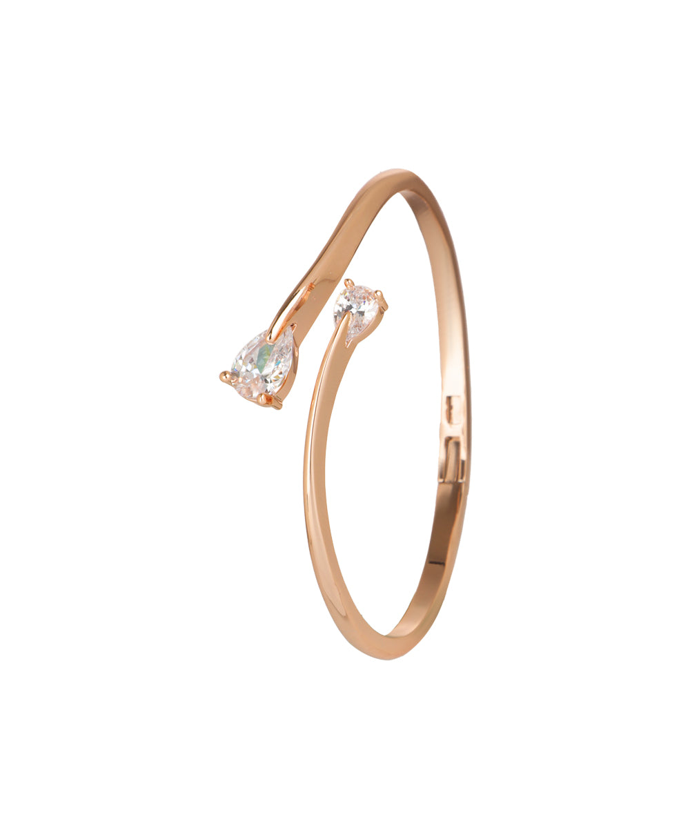 Kada bracelet featuring a teardrop cubic zirconia motif