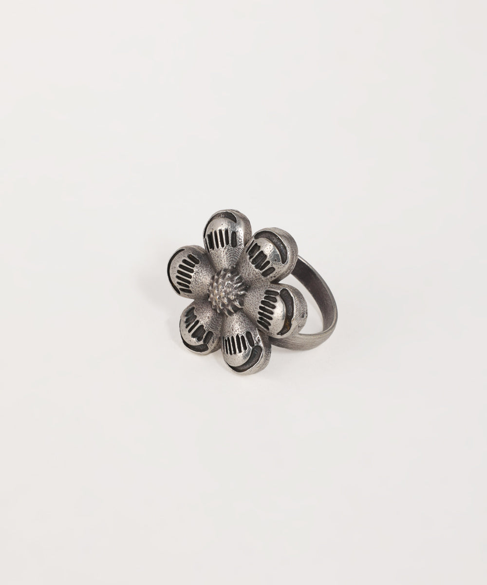 Statement oxidised ring with textured floral design and intricate metal detailing