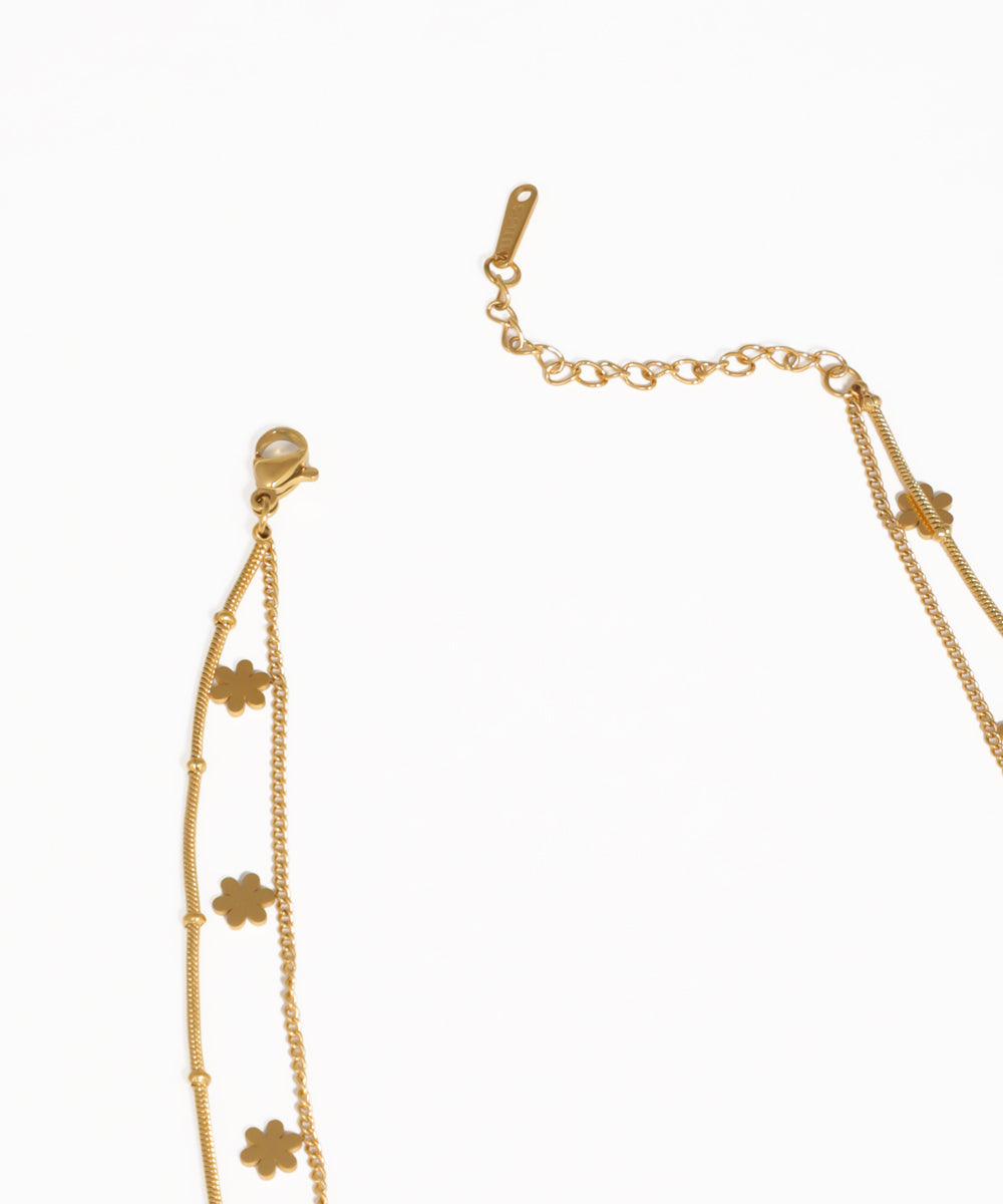 Layered floral pendant necklace with dainty gold chain design