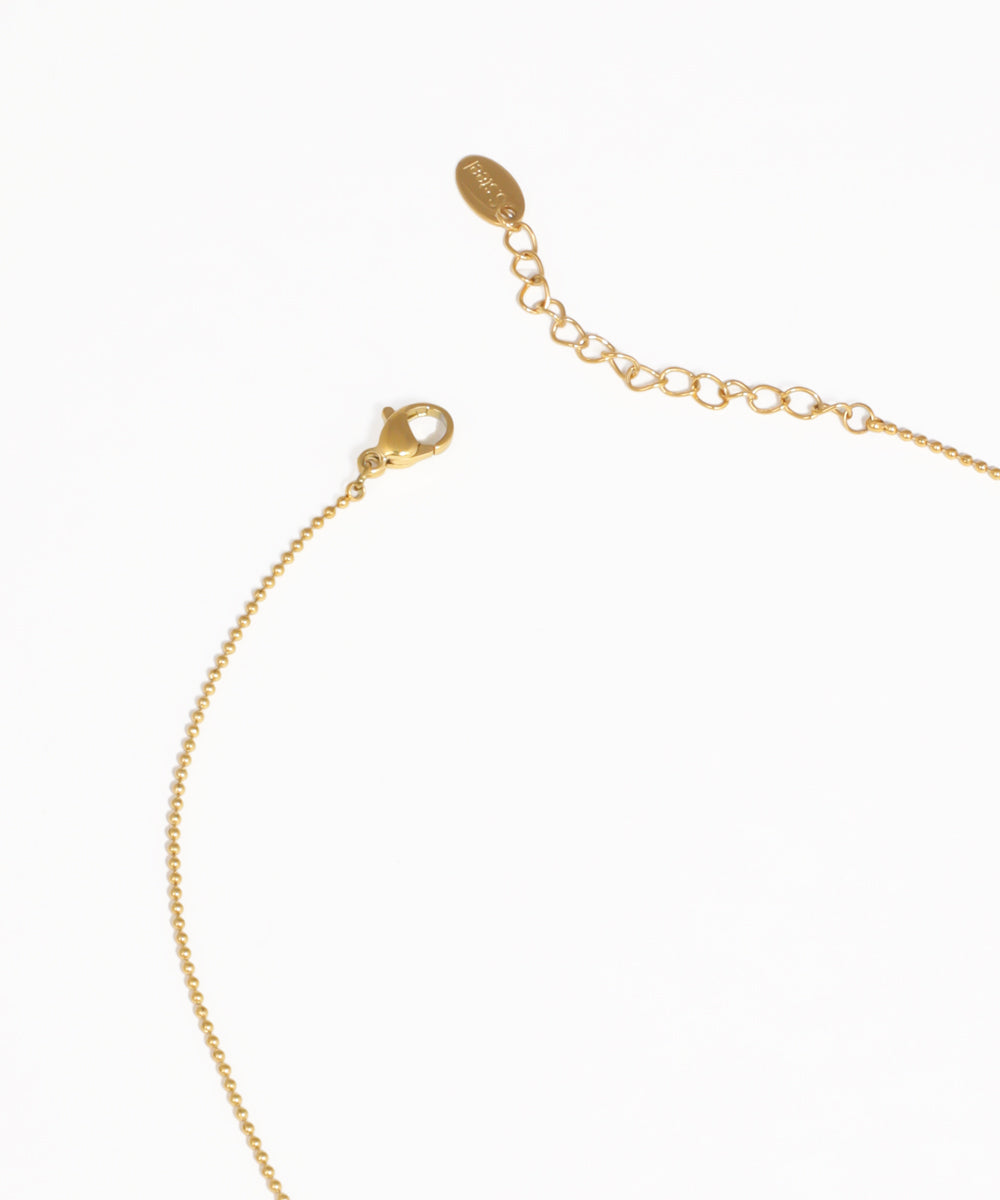 Gold drop necklace featuring sparkling stone details and fine chain