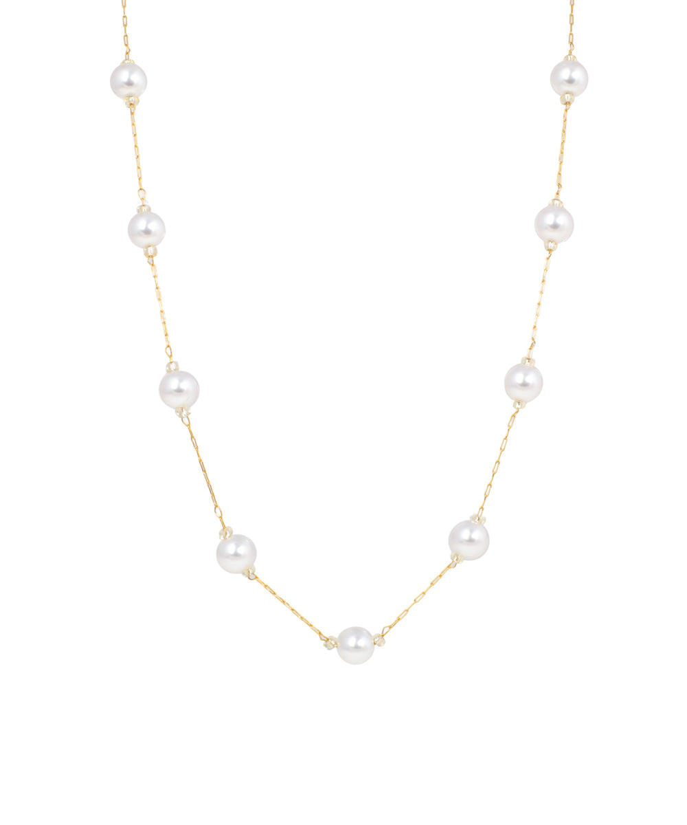 Delicate gold link chain necklace with spaced bead accents