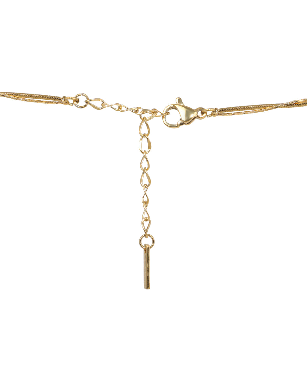 Gold layered necklace featuring geometric pendants and decorative beads