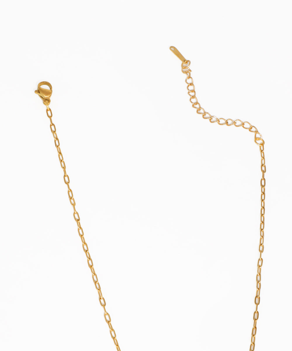 Gold starfish lariat necklace with cascading charm drop detail