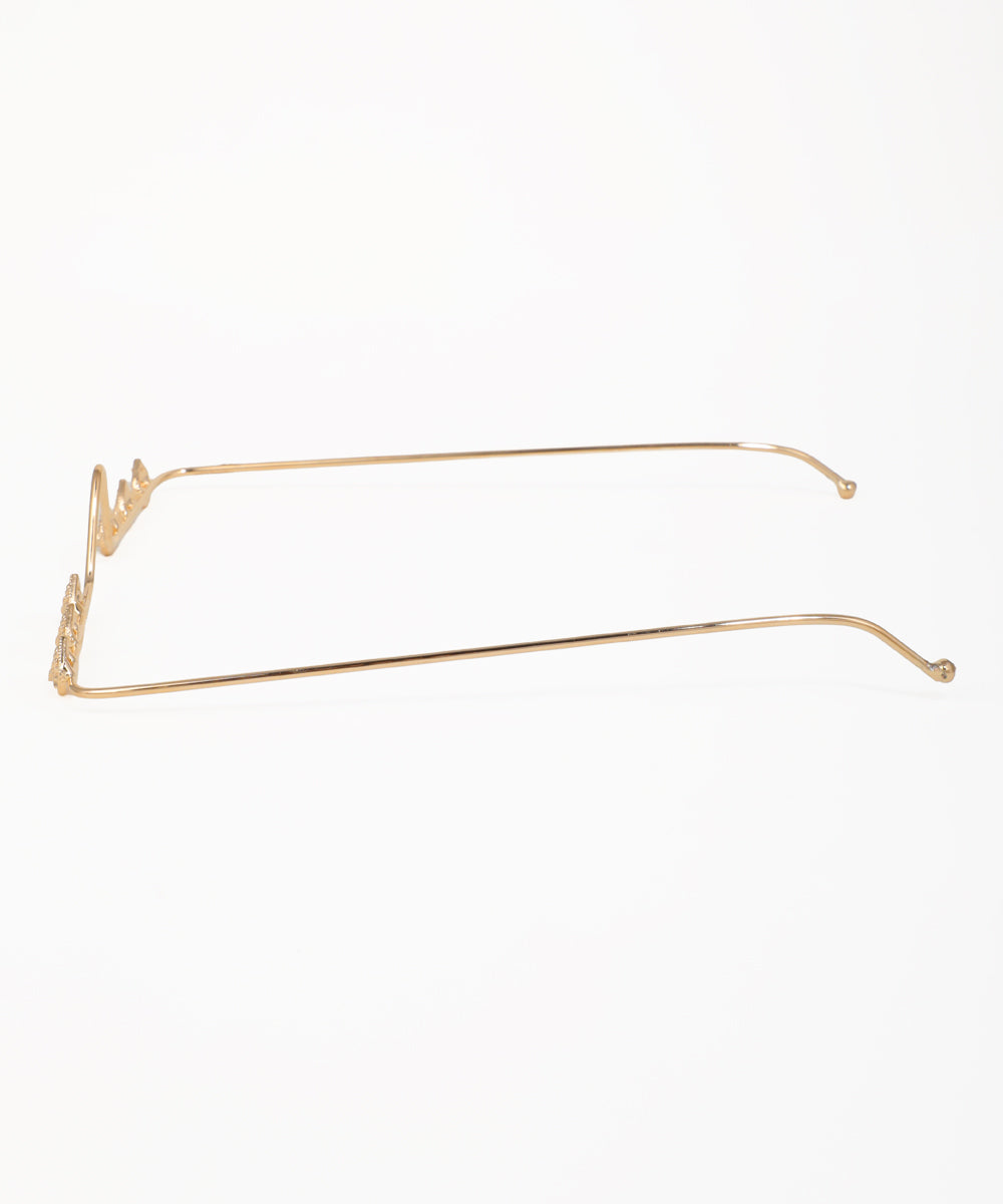 Gold-tone facelet showcasing detailed teardrop ornaments along a wavy frame
