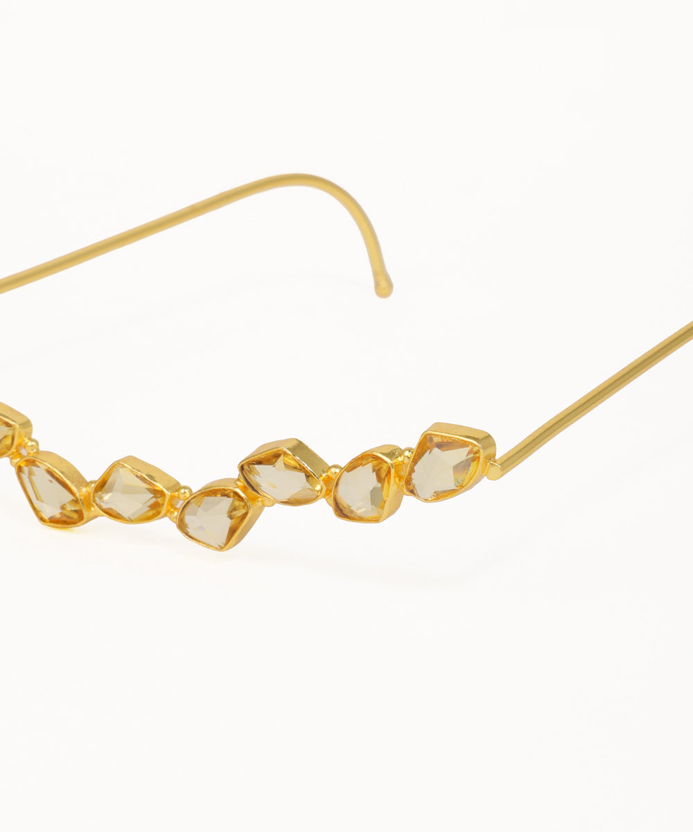 Gold facelet with curved geometric crystal details and minimalist wire frame