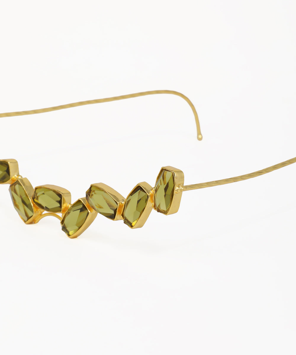 Elegant facelet with faceted olive-green gemstones and gold-tone detailing