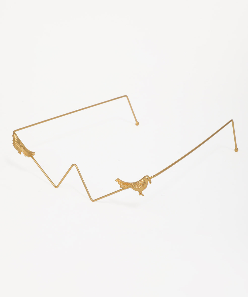 Statement facelet with artistic bird motifs and a gold zig-zag design
