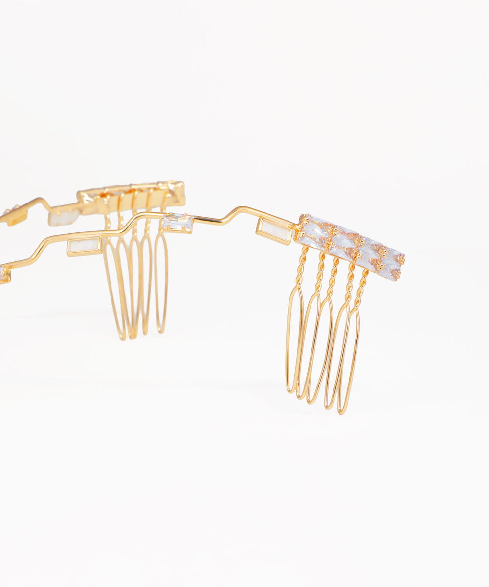 Elegant geometric headpiece with crystal accents and flowing wave pattern