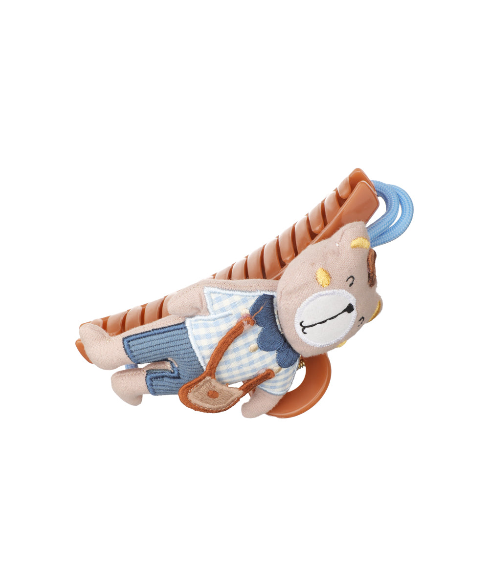 Brown plastic claw clip with a plush beige bear wearing blue overalls and checkered shirt