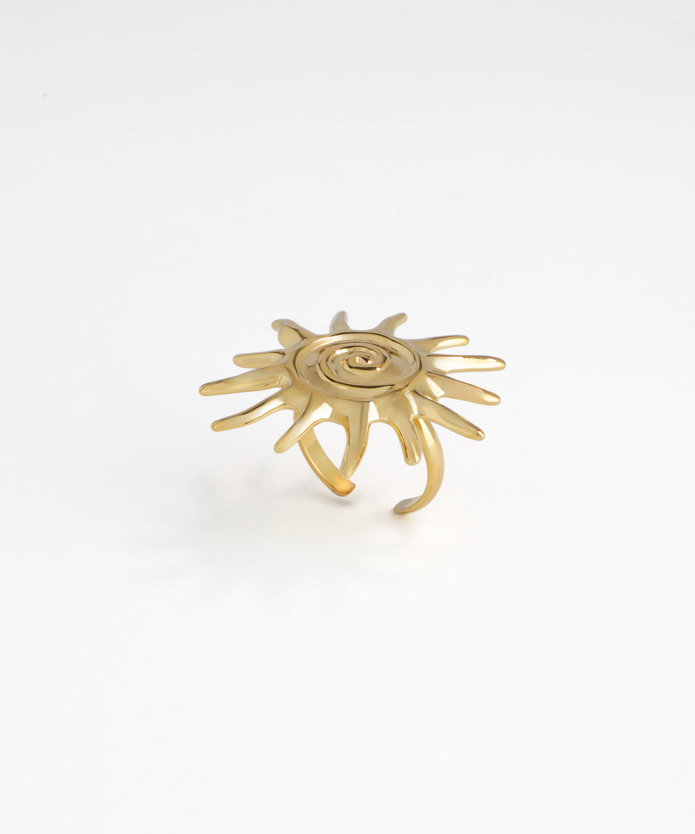 Gold-tone ring with a bold sunburst spiral design