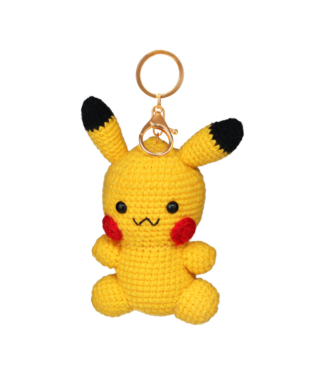 Yellow crochet keychain shaped like an animated character with black ears and gold-tone hardware.