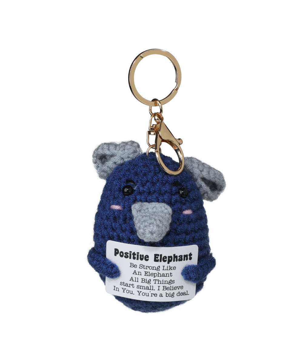 Gold-tone keychain with blue crochet elephant holding a positive message