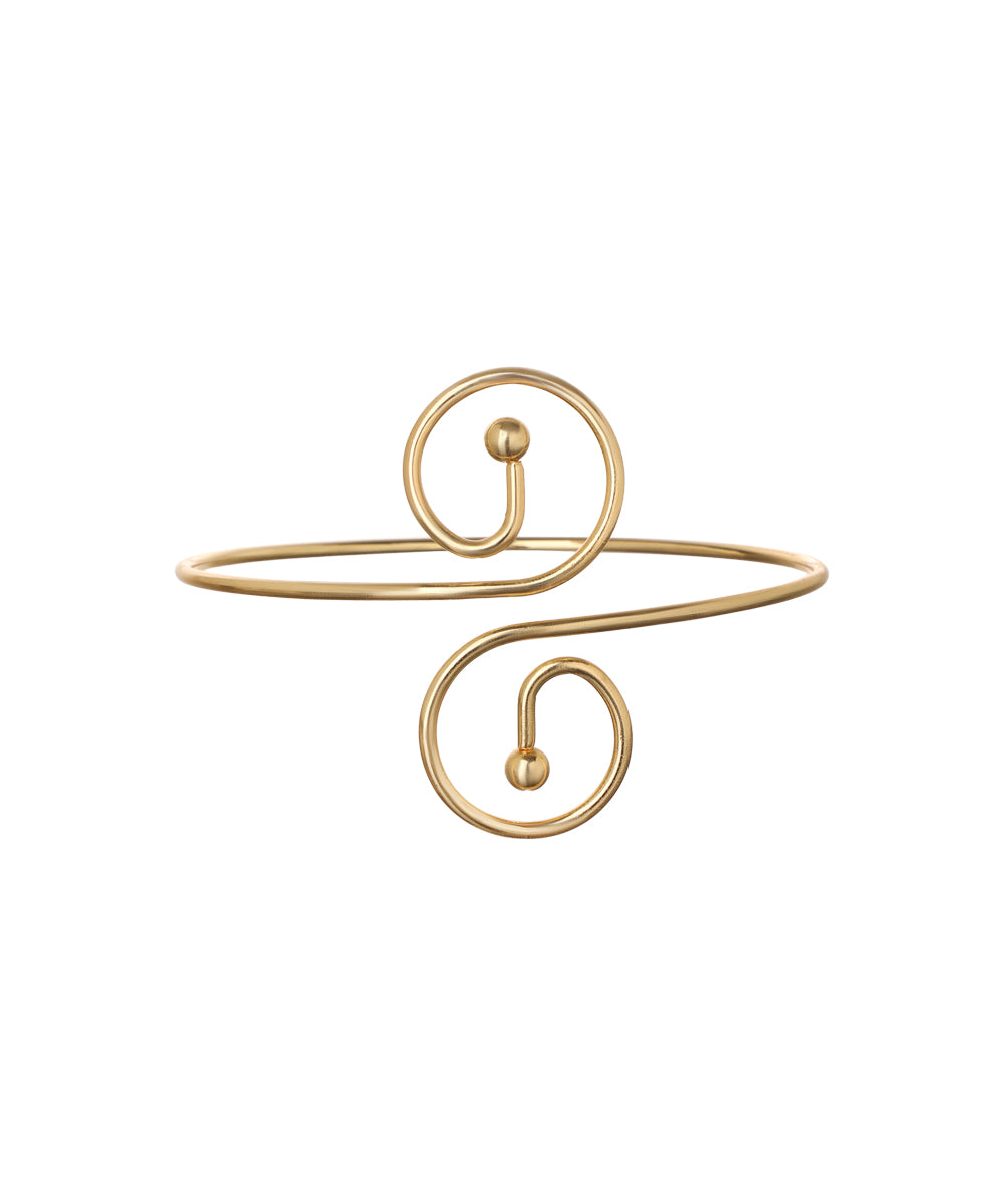 Gold-tone arm cuff with open design and double spiral ends, featuring a smooth finish and small ball tips