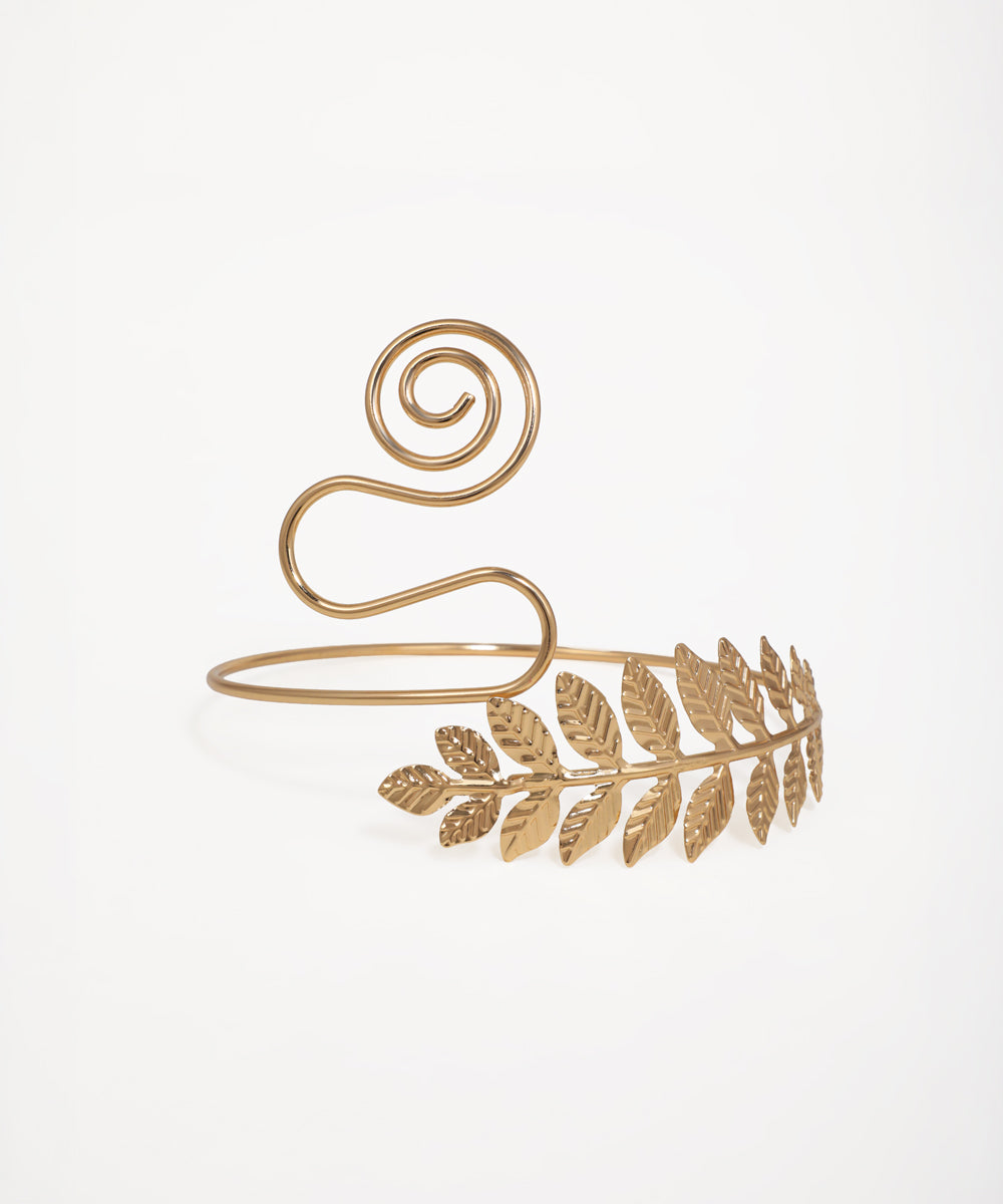Gold-tone arm cuff with textured laurel leaf design and decorative swirl