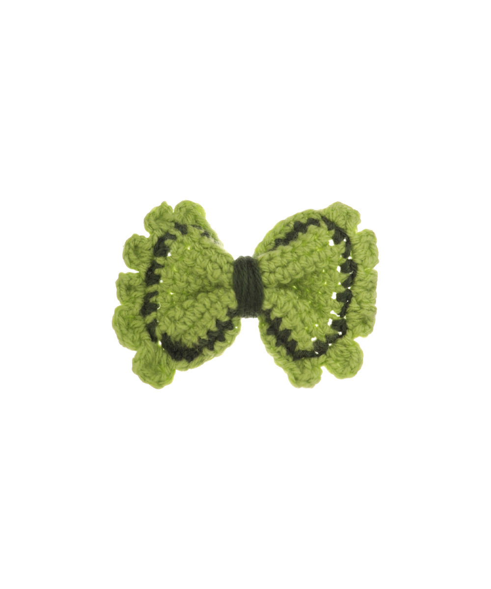Green crochet hair clip with bow shape and darker green pattern