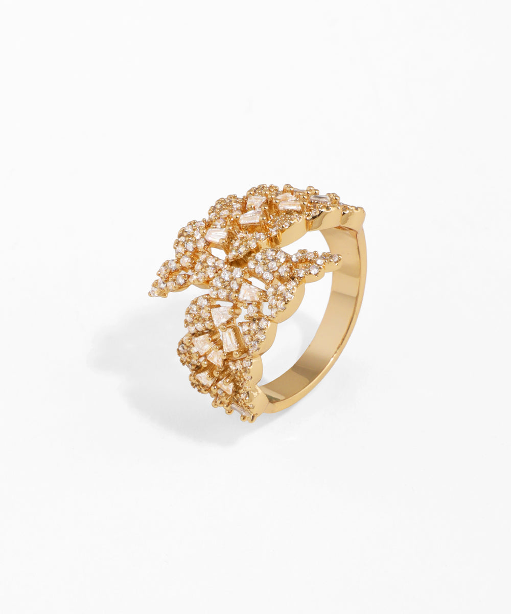 Gold-tone ring with abstract clusters of clear round and baguette-cut CZ stones on a white background