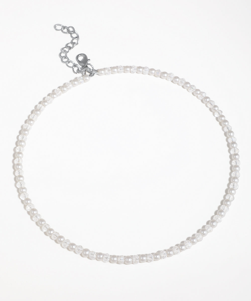 Silver-tone choker necklace with alternating faux pearl and faceted clear glass beads.