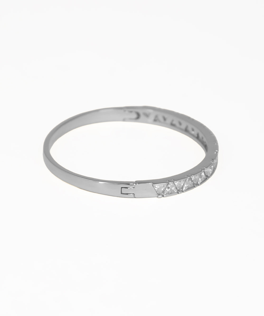 Silver ring with small diamonds on a white background