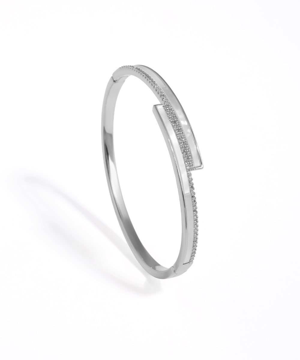 Silver bracelet with small stones on a white background