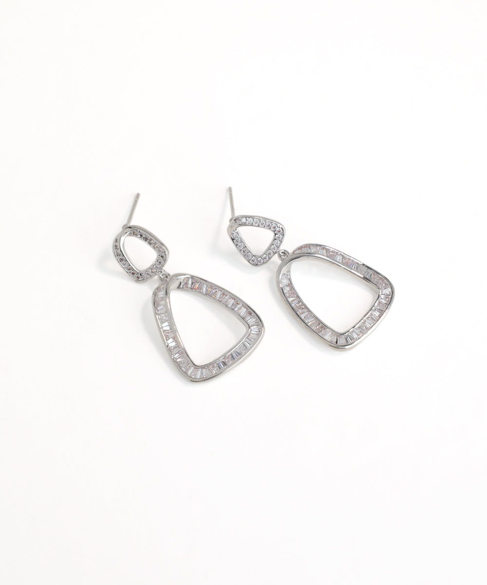 Silver teardrop earrings with clear stones on a white background