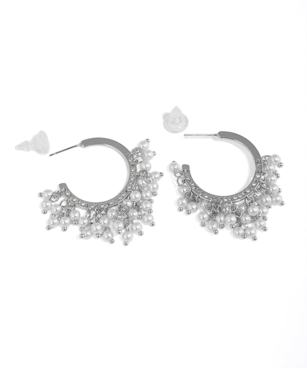 Rhodium finish earrings with crescent hoops and white faux pearl clusters