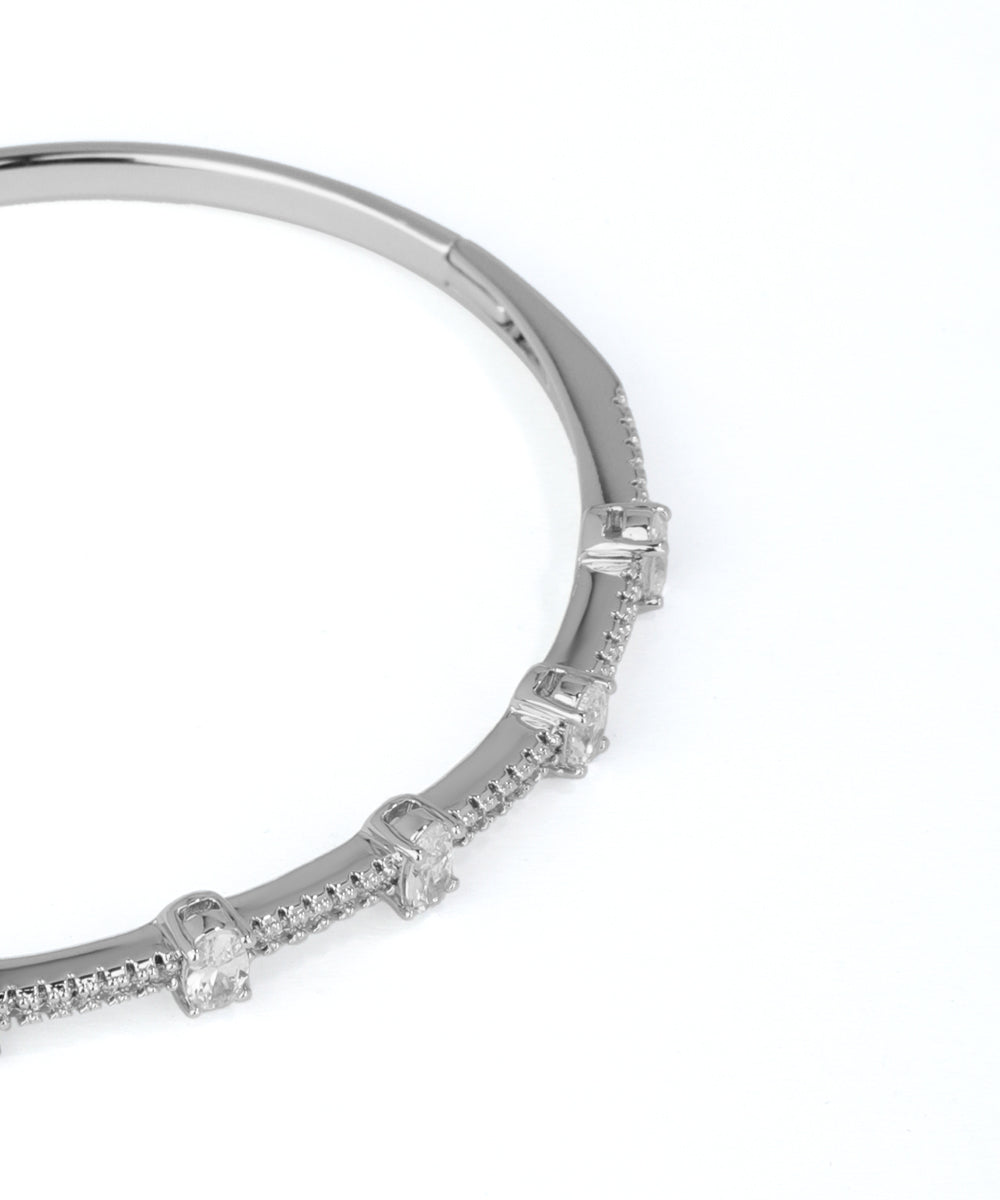 Silver bracelet with small diamonds on a white background