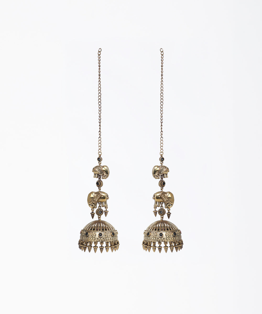 Pair of ornate earrings with intricate designs on a white background