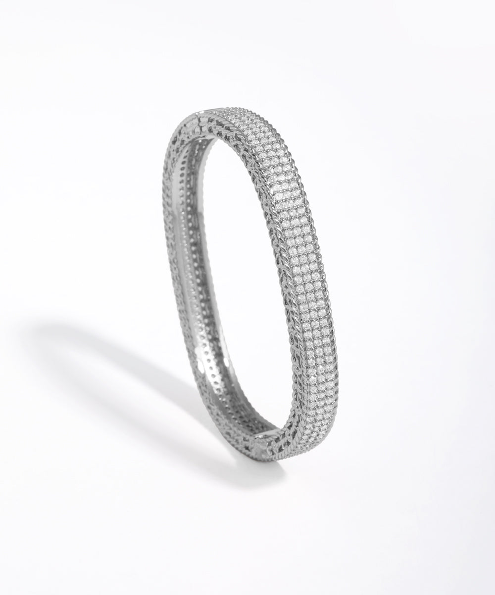 Silver bracelet with small stones on a white background
