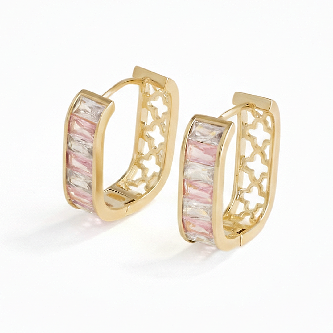 Gold hoop earrings with pink and white stone inlay on a white background