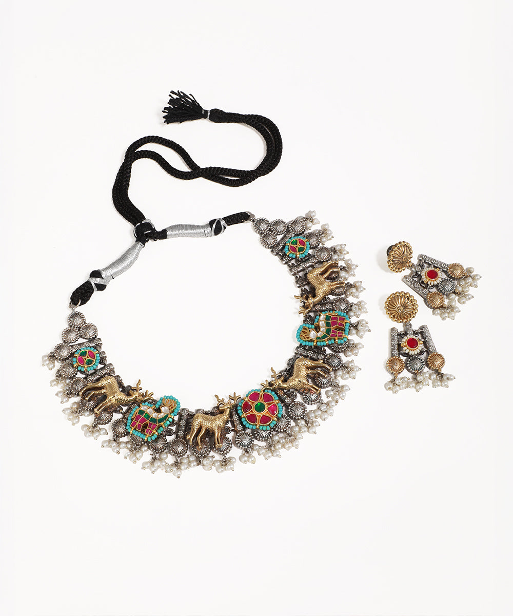 Oxidised silver-tone necklace set with gold-tone deer motifs, colorful enamel, and faux pearl drops