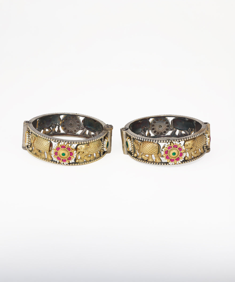 Oxidized and gold-tone bangle bracelet with elephant motifs, faux pearls, and red and green stones