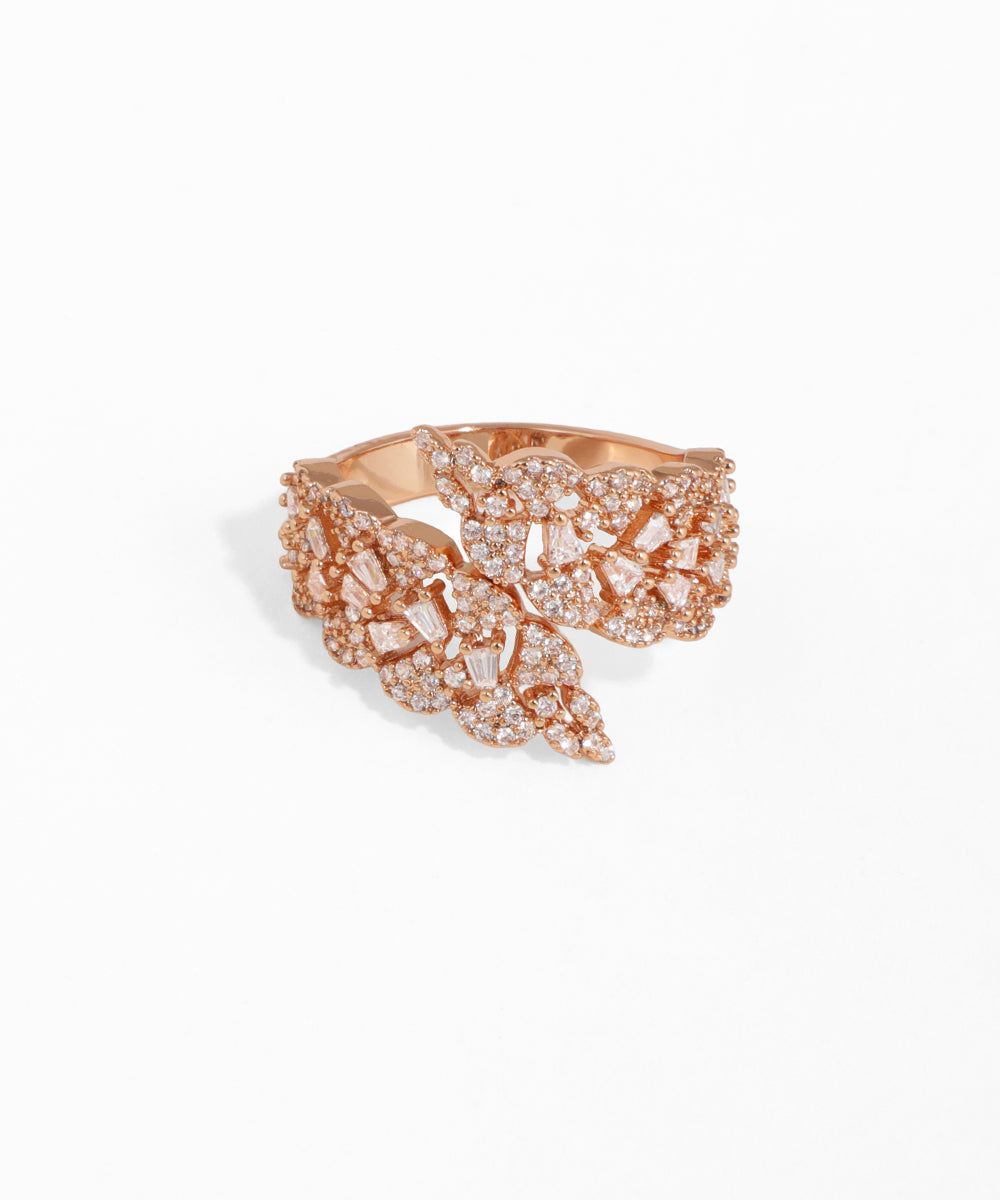 Rose gold butterfly-shaped ring with gemstones on a white background