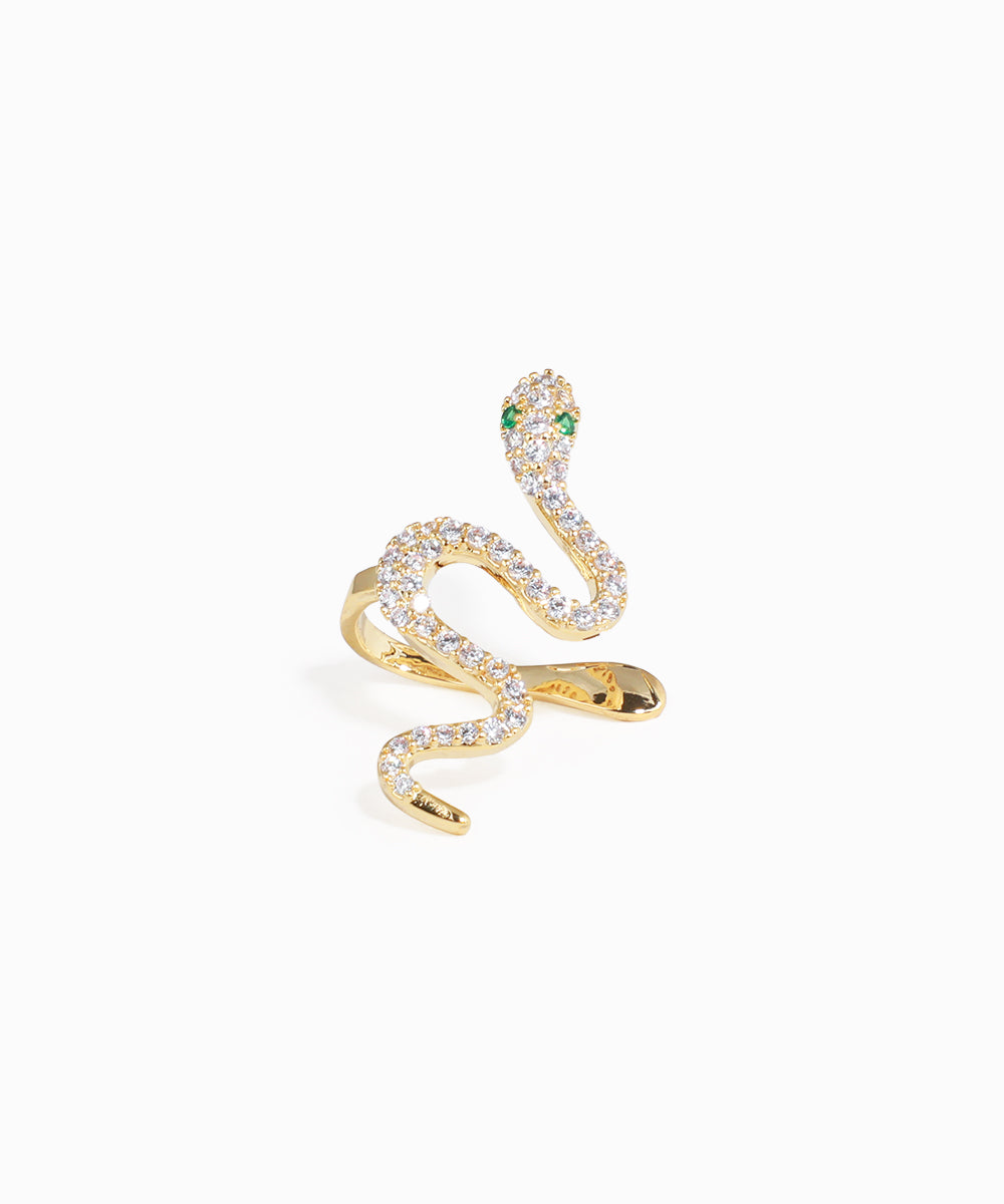 Gold snake-shaped earring with gemstones on a white background