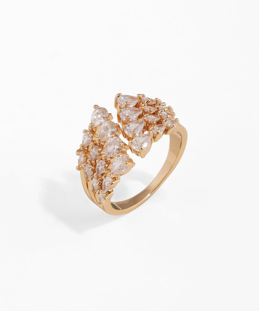 Gold ring with diamond accents on a white background