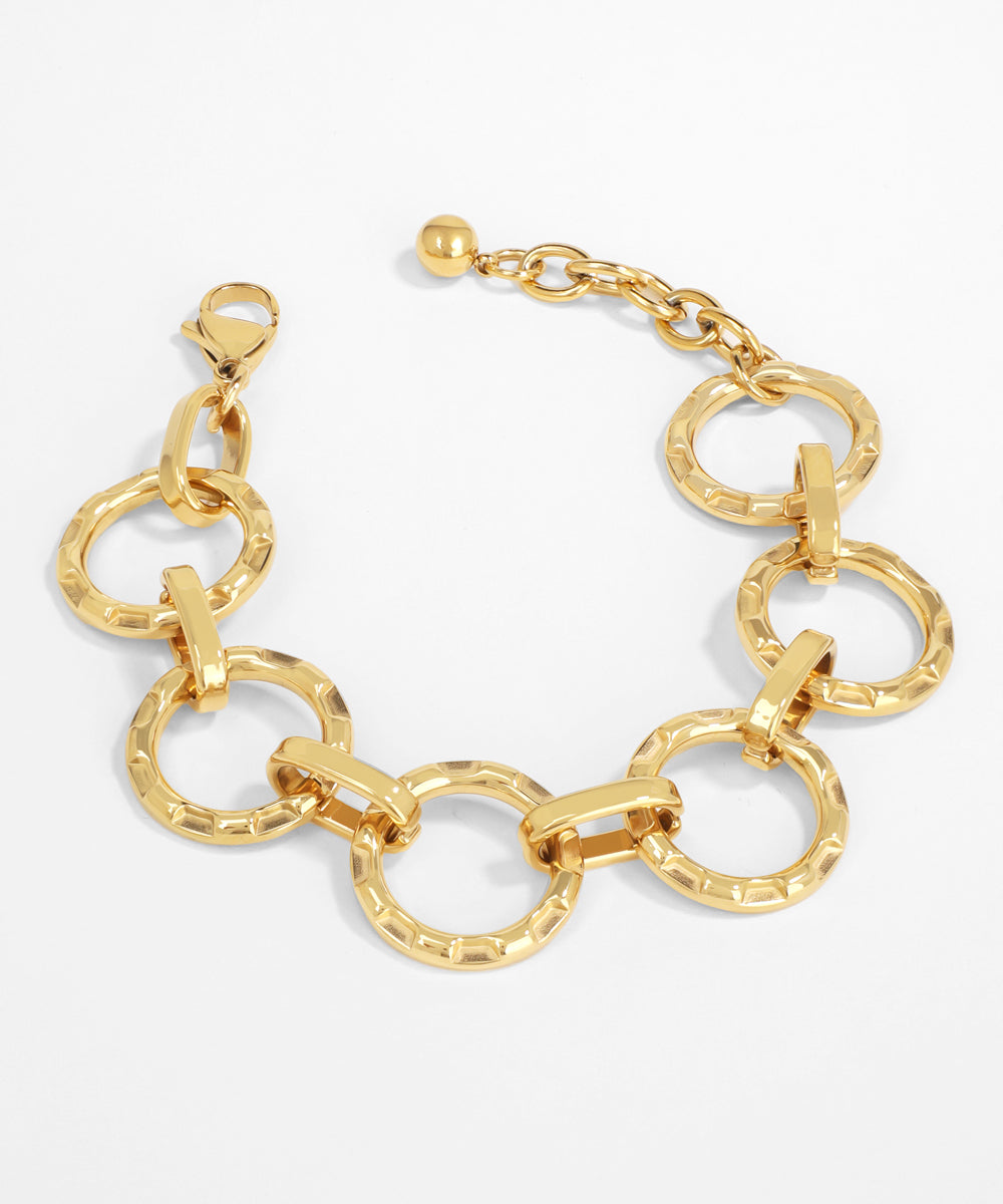 Gold chain bracelet on a white background