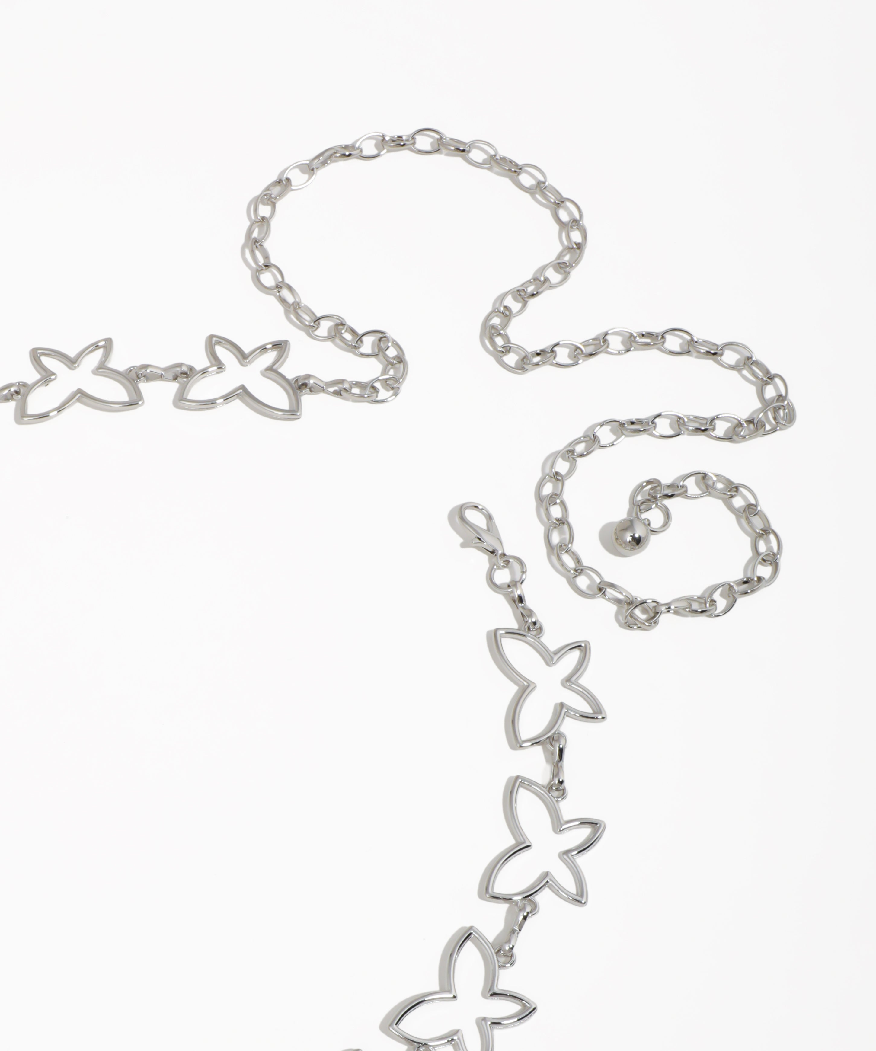 Silver butterfly-shaped necklace on a white background
