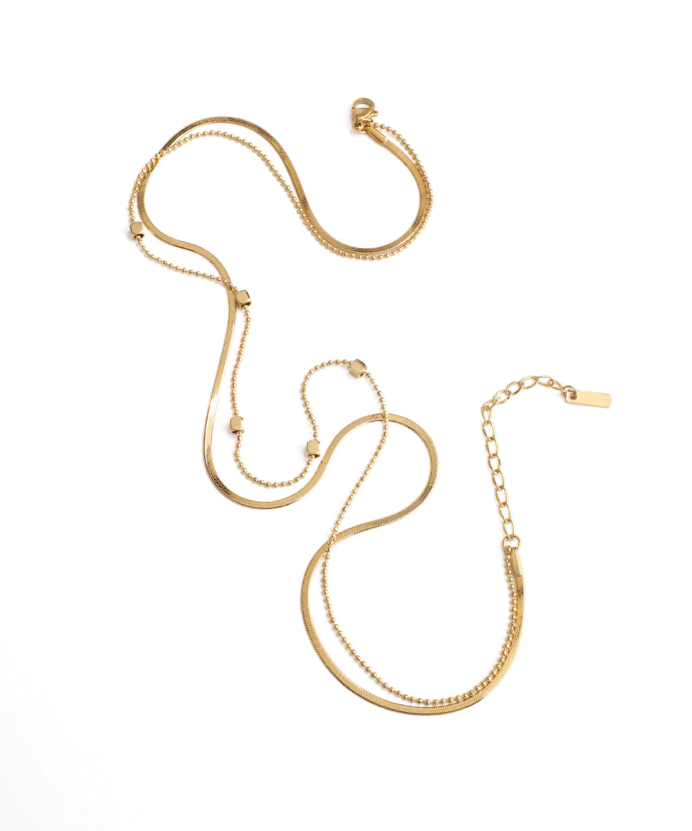 Gold necklace on a white background
