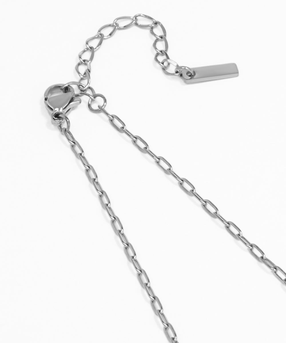 Silver chain necklace on a white background