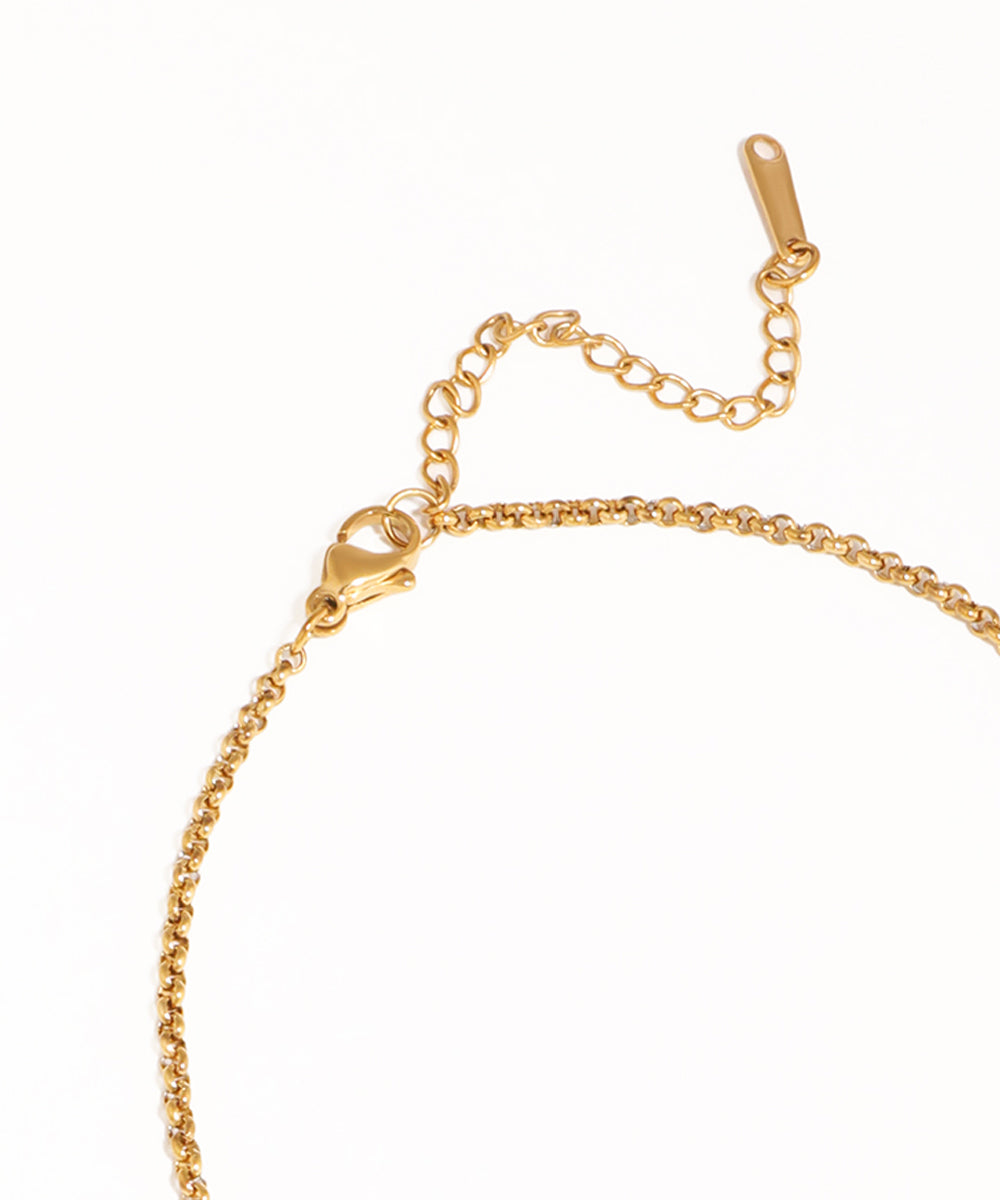Gold bracelet on a white background