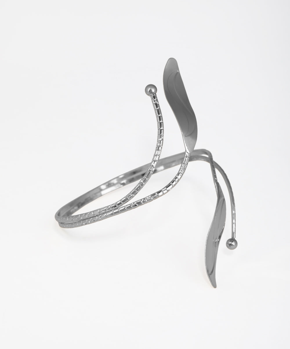 Silver bracelet with a wishbone design on a white background