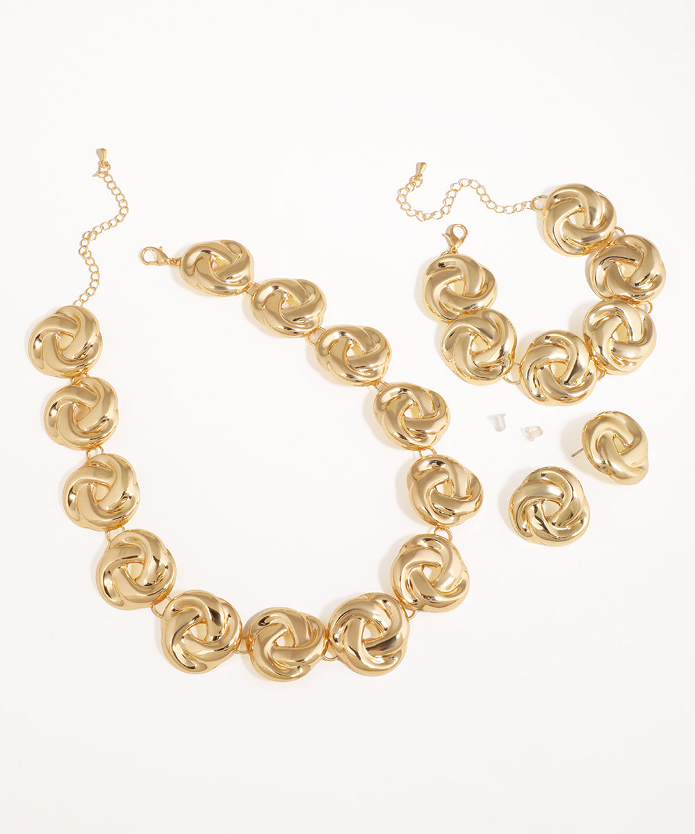 Gold-tone necklace set with chunky interlocking knot links and matching earrings and bracelet.