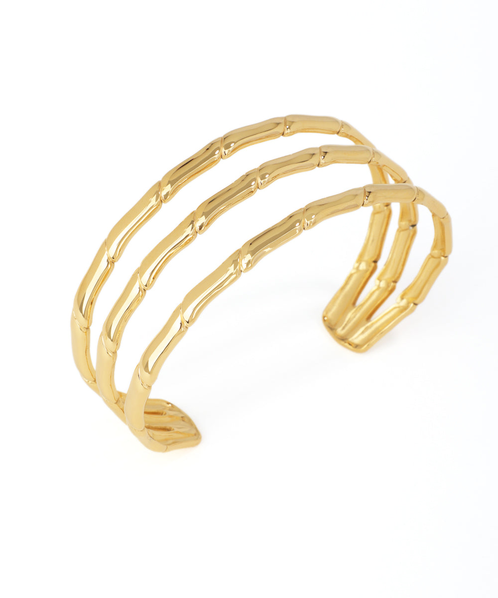 Gold bracelet with a white background