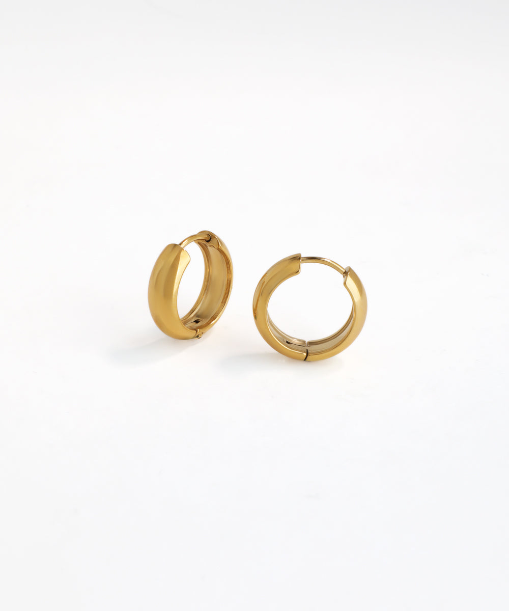 Gold hoop earrings on a white background